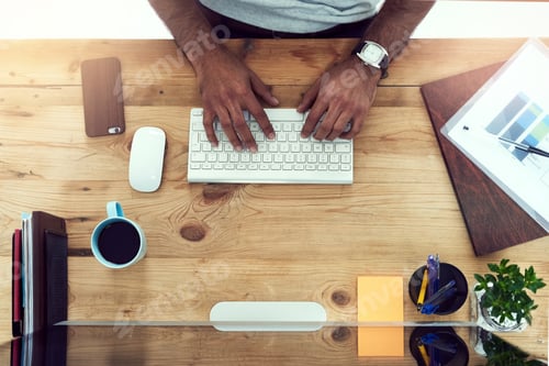 Preview: Person Typing at Desk with Office Supplies