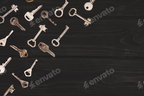 Preview: top view of different vintage keys on black table