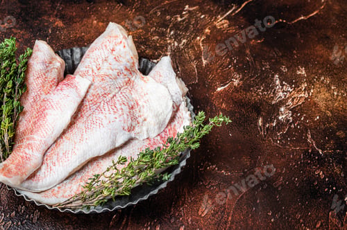 Preview: Raw ocean red perch fillet, Snapper fish with herbs. Dark background. Top view. Copy space