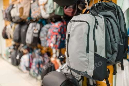 Preview: Showcase with backpacks in sports shop, nobody