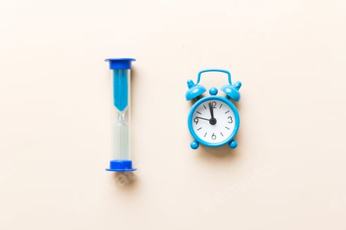 Preview: hourglass and clock as time passing concept for business deadline, urgency and running out of time