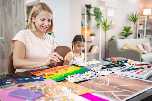 Preview: Mother and daughter engaged in creative art activity