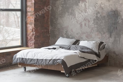 Preview: Loft style bedroom interior with bed, gray design, brick texture and concrete wall