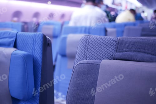 Preview: purple color Empty passenger airplane seats in the cabin