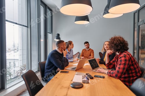 Preview: In the vibrant ambiance of a modern startup office, a diverse team of business professionals engage