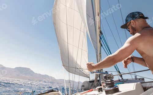 Preview: Handsome man sailor in action