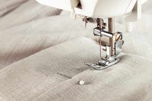 Preview: Modern sewing machine presser foot and item of clothes. Sewing process, handmade, hobby, business