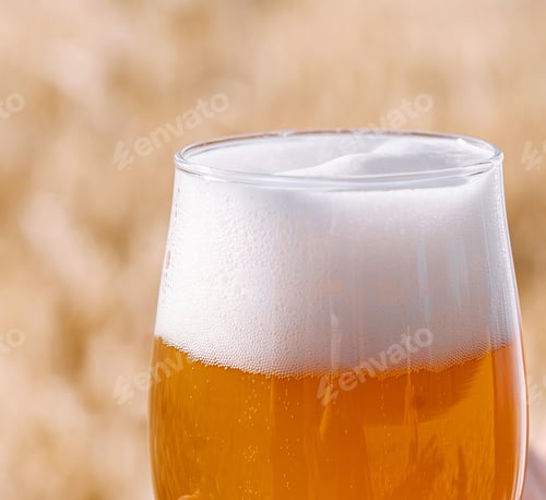 Preview: glass of beer against the background of wheat field