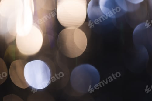 Preview: White and blue bokeh lights with copy space on dark background