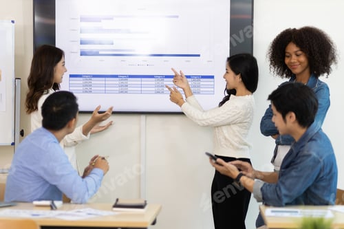 Preview: Professional marketer is making a presentation during a planning business meeting with colleagues.