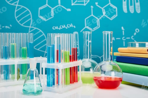 Preview: books, glass test tubes and flasks with colorful liquid on blue background with molecular structure