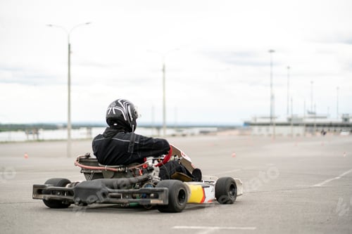 Preview: a racer pilot driving a karting car machine, auto competition