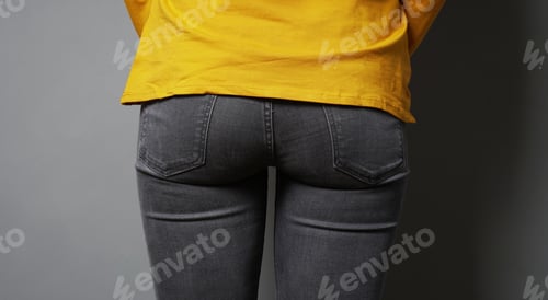 Preview: female butt or bottom wearing black denim jeans
