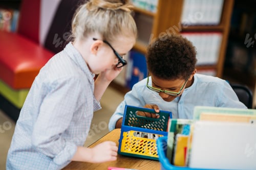 Preview: adorable little kids choosing supplies in box