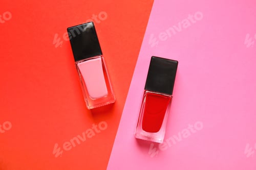Preview: Bottles of nail polish on color background, top view