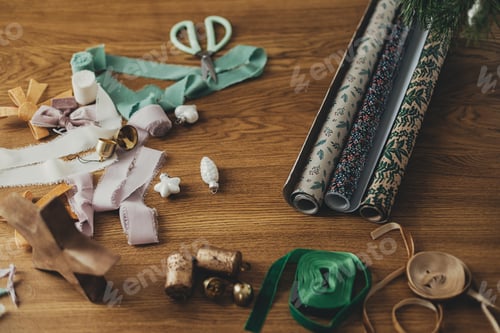 Preview: Stylish christmas wrapping paper, ribbons, scissors, star and brass bells