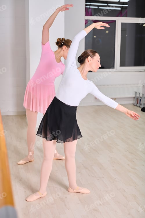 Preview: Ballerinas in graceful rehearsal at ballet barre