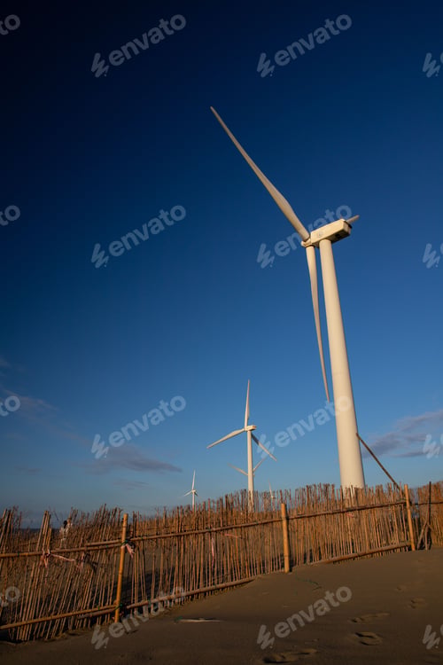 Preview: Vertical shot of a row of wind turbines on Caota dune beach in Taiwan