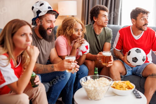 Preview: People watching football and cheering at home