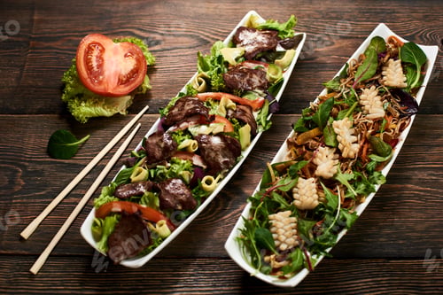 Preview: Serving sushi rolls and other traditional japanese and asian food on a table