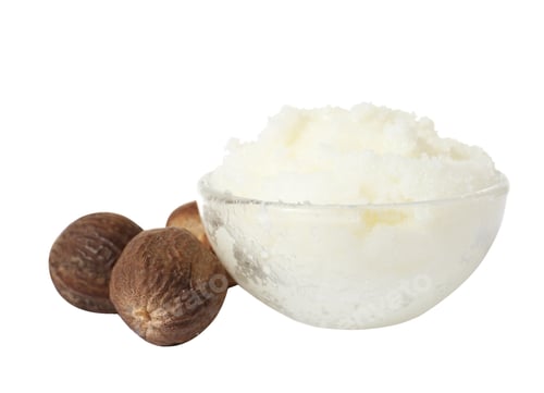 Preview: Shea butter in bowl and nuts isolated on white