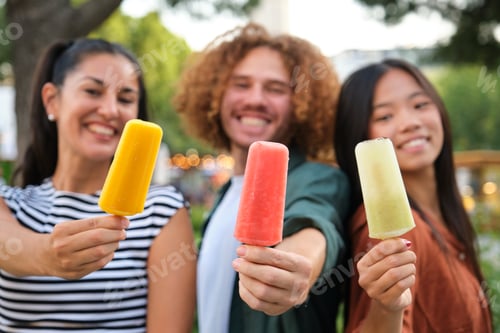 Preview: Three friends showing colorful ice cream bars at a park