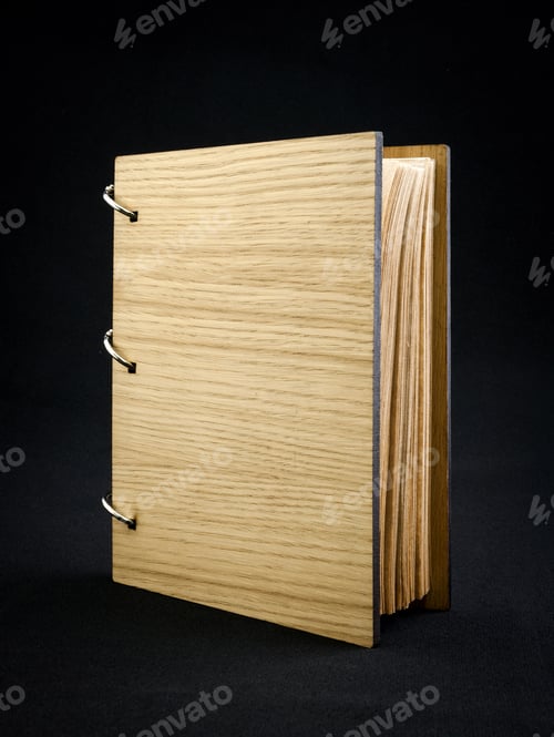 Preview: Wooden notebook on a dark background.