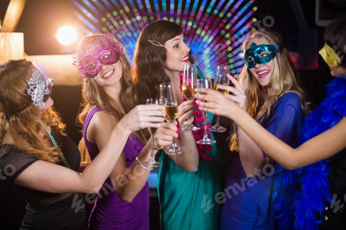 Preview: Group of friends toasting glass of champagne