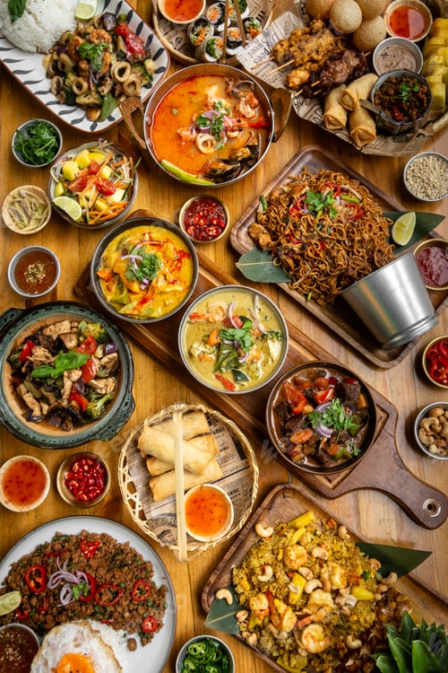 Preview: many different thai food dishes on table in modern restaurant in bangkok thailand