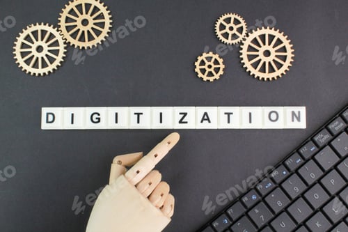 Preview: gear teeth and laptop keyboard with the word digitization.