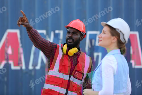 Preview: Foreman control loading Containers box from Cargo freight ship for import export.
