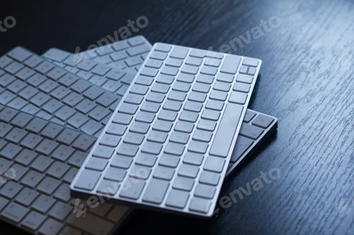 Preview: closeup of computer keyboards on a black dark desk