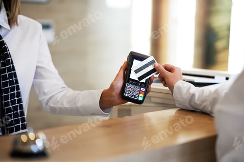 Preview: Receptionist and businesswoman at hotel front desk