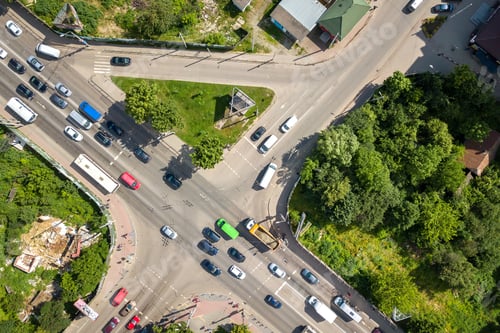 Preview: Top down aerial view of busy street intersection with moving cars traffic