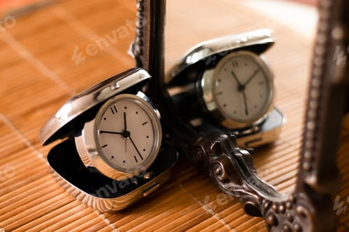 Preview: Pocket folding watch in the mirror. Time concept