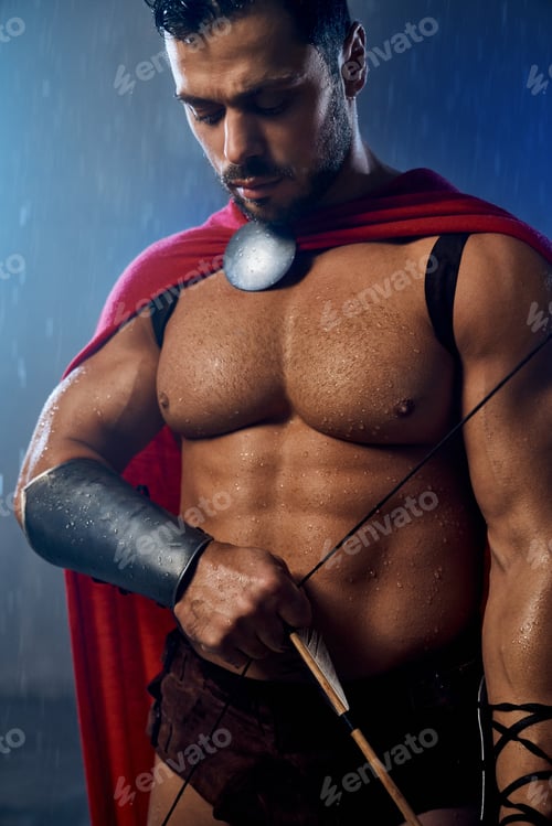 Preview: Muscular wet spartan holding bow with arrow