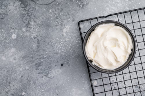 Preview: Healthy Fresh greek yogurt in a bowl. grey background. top view