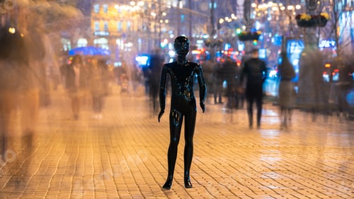 Preview: The dummy standing on the crowd street. evening time