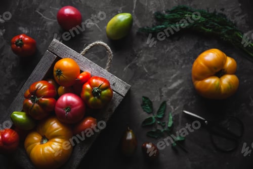 Preview: Fresh tomatoes in an old box. On wooden background
