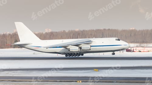 Preview: Huge white wide-body cargo airplane take off at sunny winter day. Transportation, cargo, aviation.