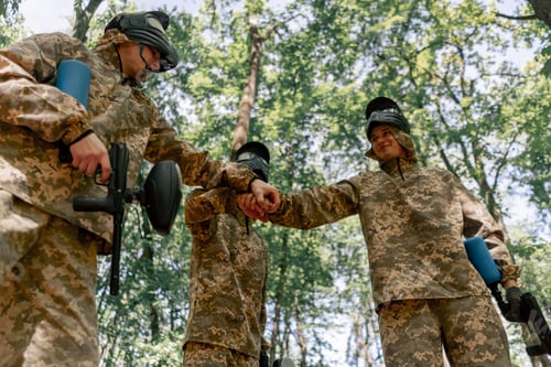 Preview: in the forest in the middle of the field pinball players in uniform team hugging positive mood