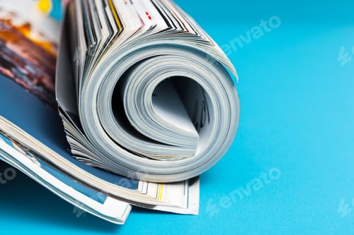 Preview: Glossy magazine with pages rolled