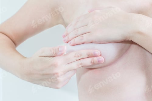 Preview: Topless female checking up breast changes, possible lumps, distortions, or swelling