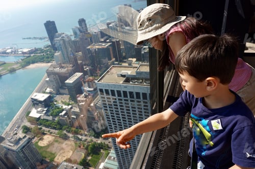 Preview: Children looking at view of Chicago skyscrapers