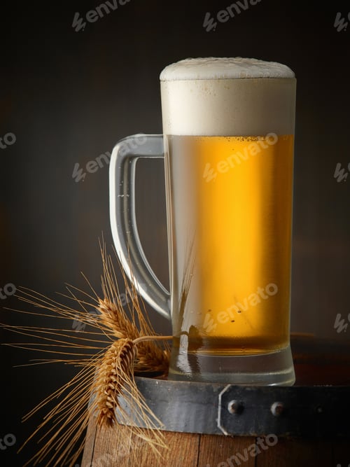 Preview: beer jug on old wooden barrel