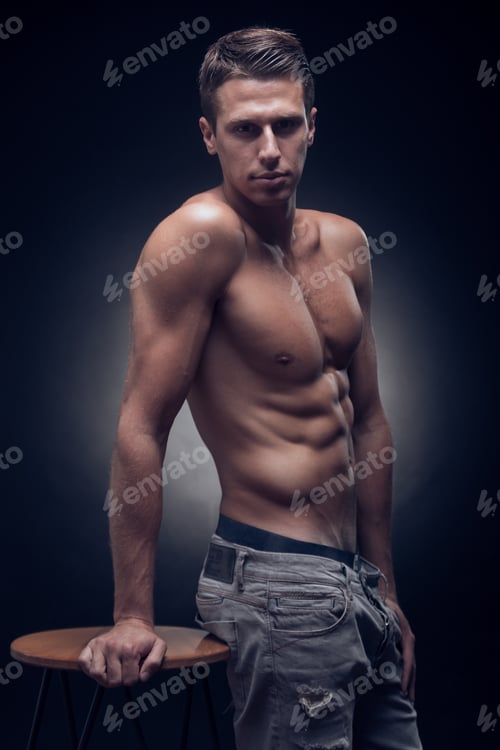 Preview: One Young Adult Man, Caucasian, Fitness Model, Muscular Body, Shirtless, Jeans, Black Background