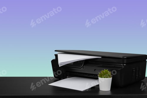 Preview: Home laser printer on desk against purple background