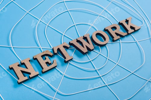 Preview: The word network with wooden letters in the form of an abstract spider web
