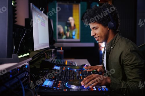 Preview: Portrait of radio host using sound mixer in studio