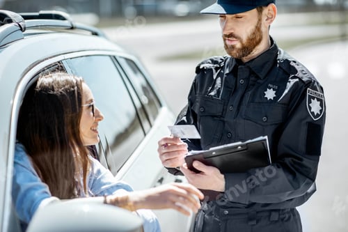 Preview: Policeman with woman driver on the road